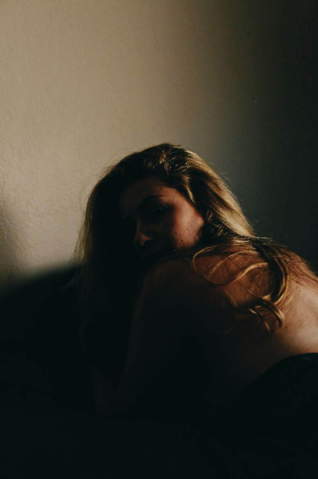 Woman meditating in a calm room with eyes closed