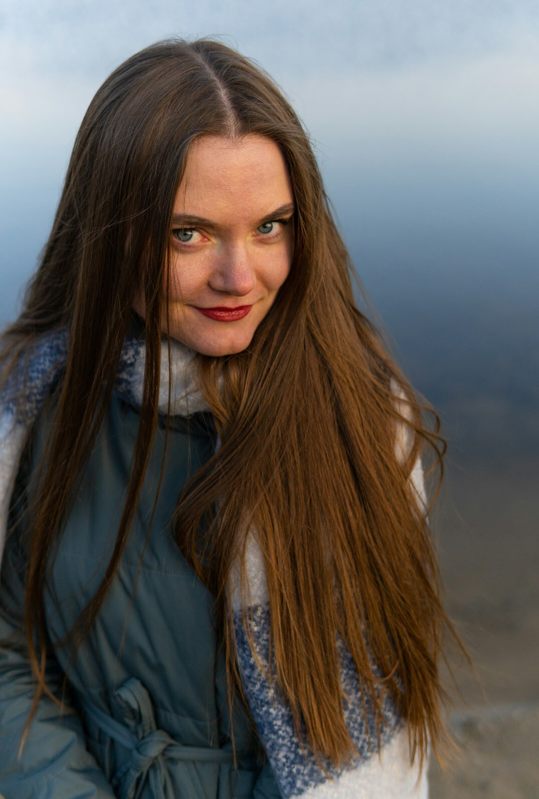 Portrait of a smiling woman with long hair