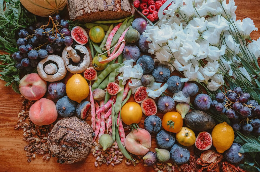 Fresh vegetables and fruit arranged on a table