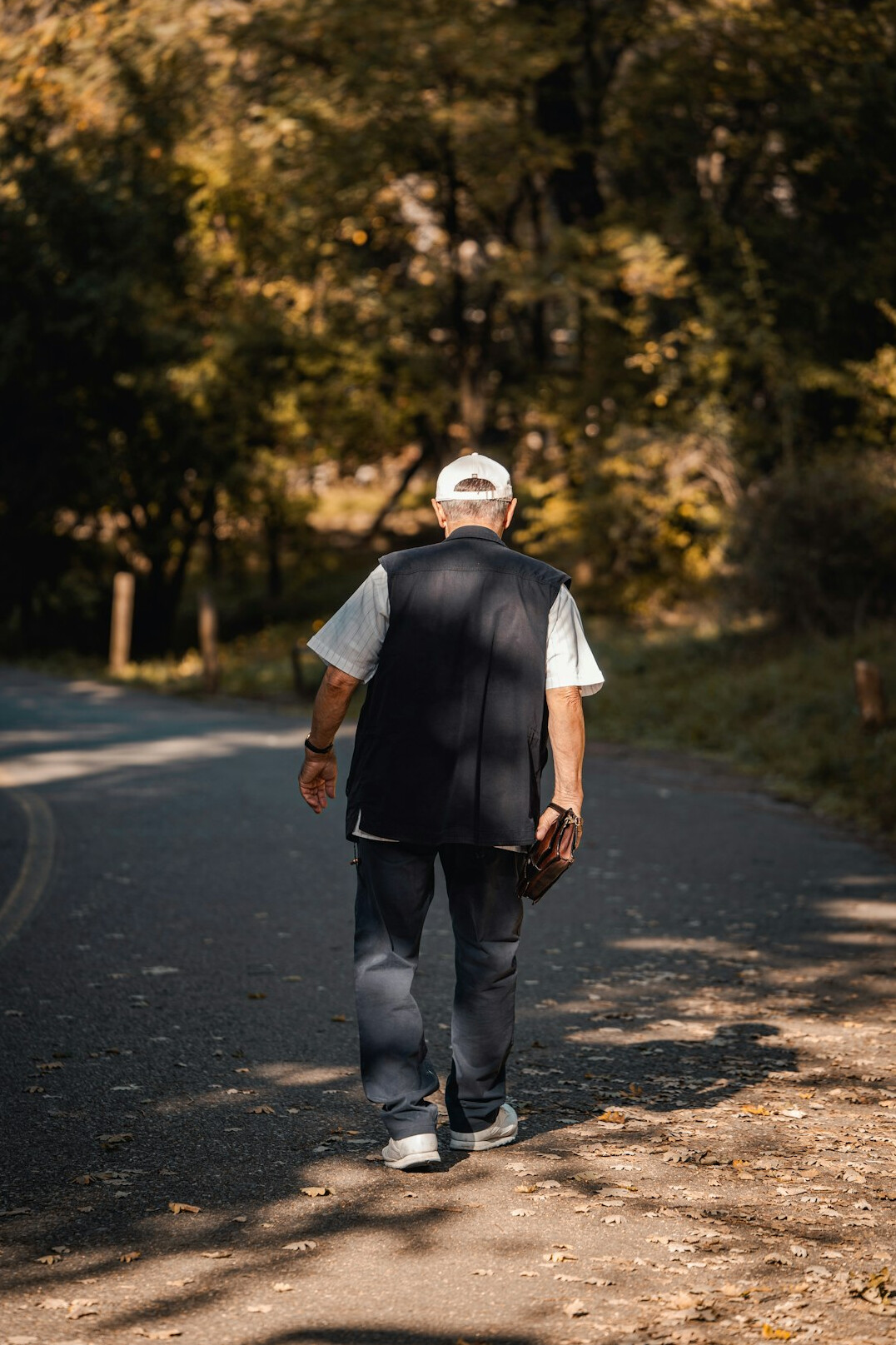 elderly person walking in nature