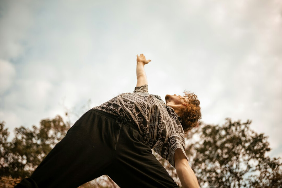 senior doing yoga outdoors